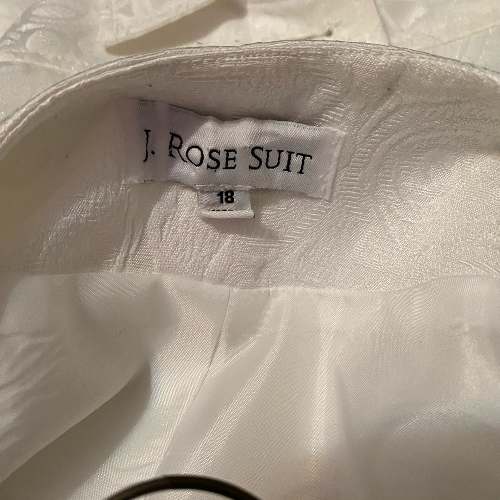 Suits and Dresses for sale; ranging from white, cream, silver, purple, peach,etc